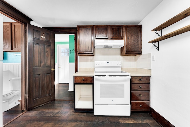 kitchen with light countertops, dark brown cabinets, under cabinet range hood, white electric range, and backsplash