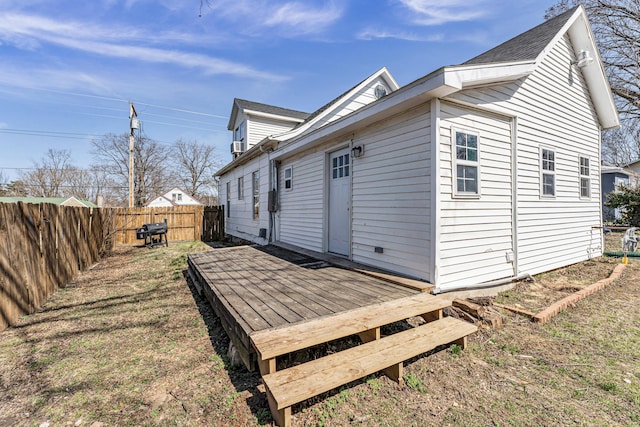 exterior space with a deck and a fenced backyard