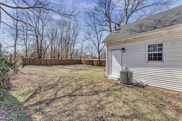 view of yard featuring cooling unit and a fenced backyard