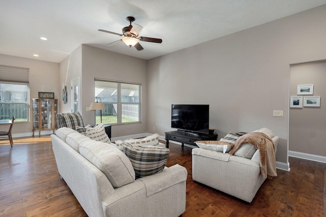 living area with dark wood-style floors, recessed lighting, a ceiling fan, and baseboards