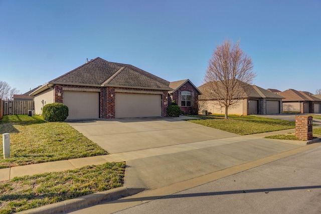 ranch-style house with brick siding, an attached garage, concrete driveway, and a front lawn