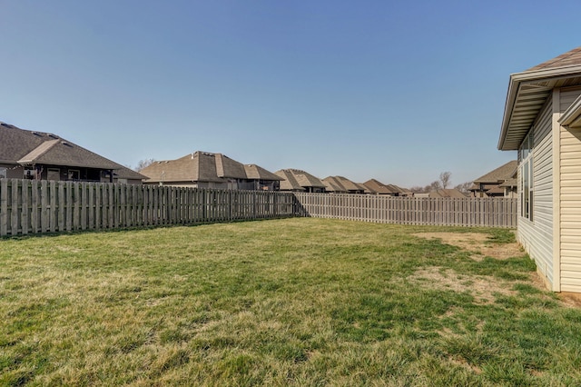 view of yard with a fenced backyard