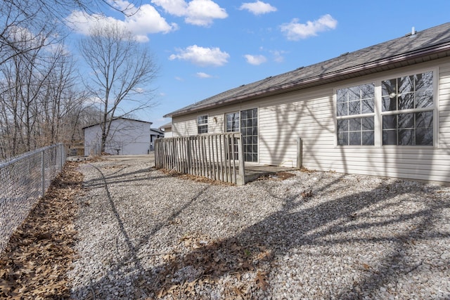 rear view of property with fence