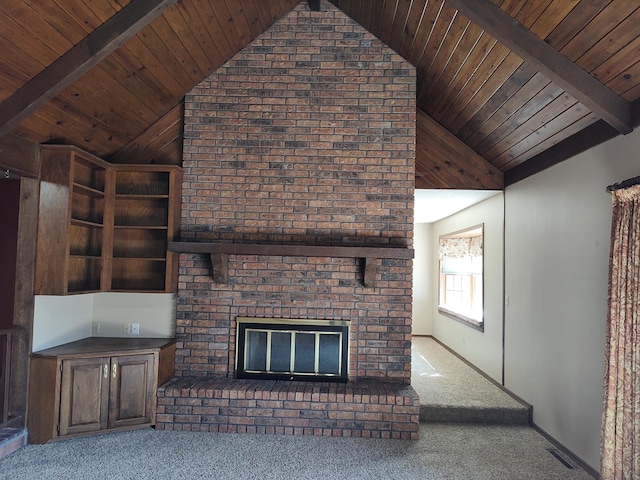 unfurnished living room with wood ceiling, a brick fireplace, vaulted ceiling with beams, and carpet flooring