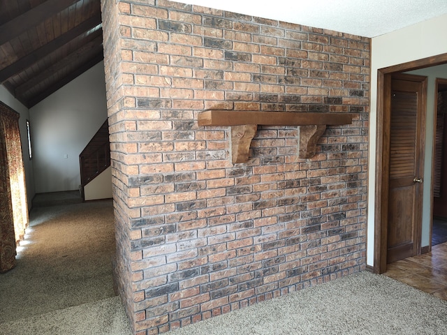 room details featuring beam ceiling, carpet flooring, and a textured ceiling