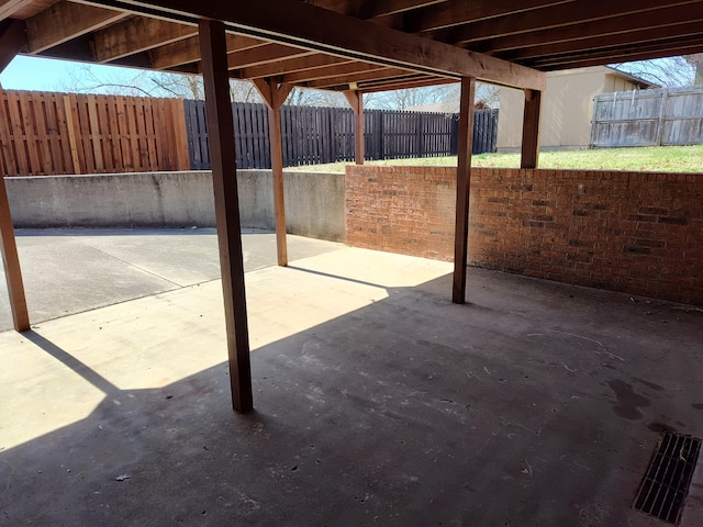 view of patio featuring fence