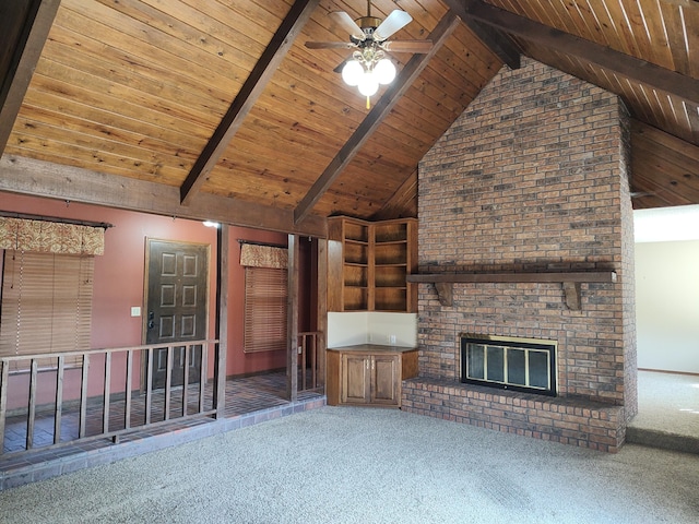 unfurnished living room featuring beam ceiling, wood ceiling, and carpet floors