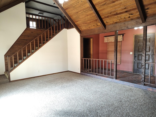 unfurnished living room with baseboards, beamed ceiling, stairs, carpet floors, and wooden ceiling