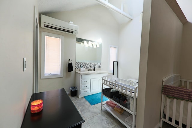 bathroom featuring lofted ceiling, vanity, and a wall mounted AC