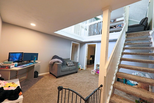 interior space with baseboards and carpet