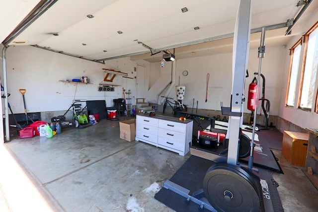 garage featuring a workshop area and a garage door opener