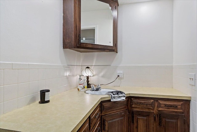 kitchen featuring dark brown cabinets and light countertops