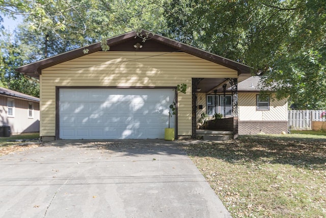 view of front of home featuring brick siding and concrete driveway