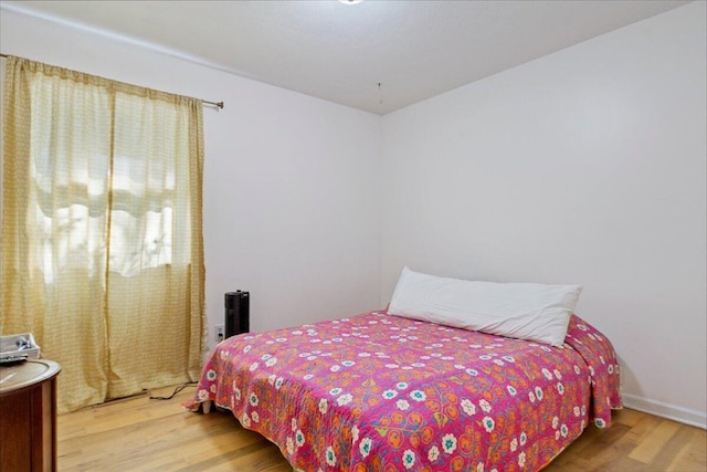 bedroom featuring wood finished floors