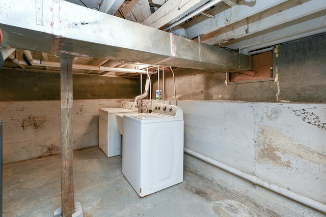 unfinished below grade area with independent washer and dryer