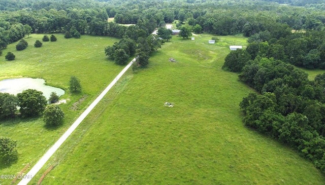 birds eye view of property with a rural view