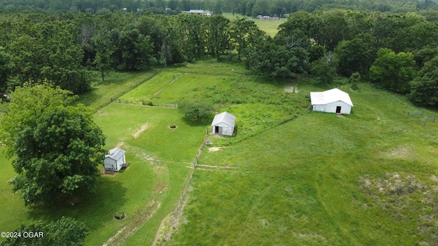 birds eye view of property featuring a rural view