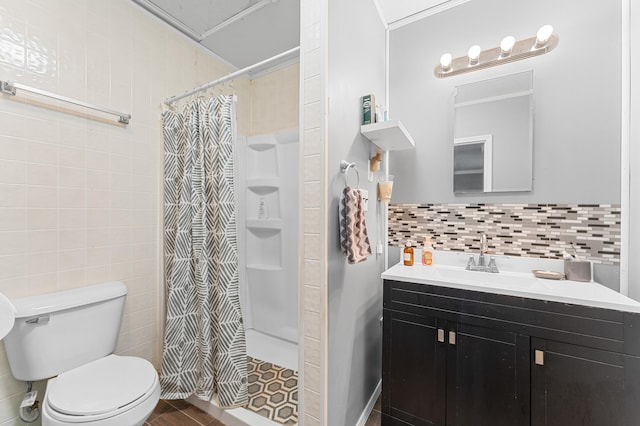 full bathroom featuring vanity, toilet, tile walls, and a shower stall