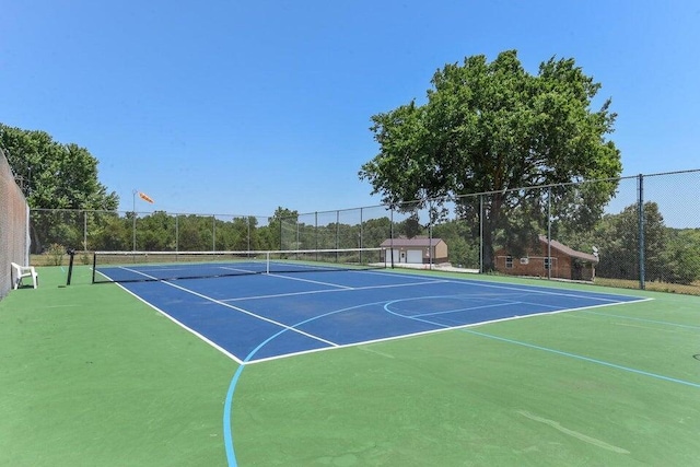 view of sport court featuring community basketball court and fence