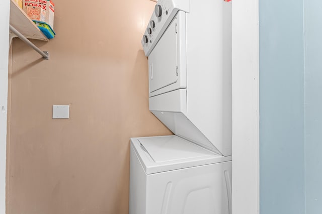 laundry room with laundry area and stacked washing maching and dryer