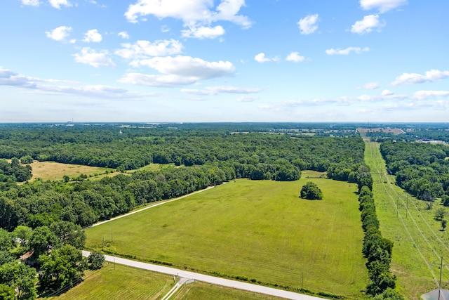 drone / aerial view with a rural view and a wooded view