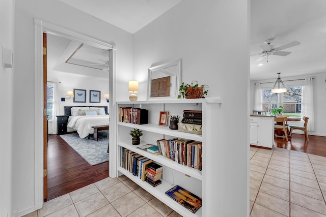 hallway featuring light tile patterned floors