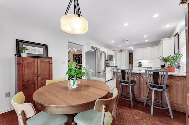 dining space featuring recessed lighting, baseboards, light wood-style floors, and ceiling fan