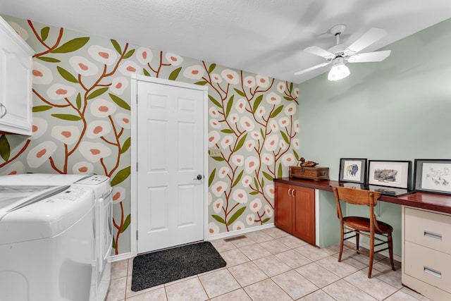 interior space featuring washer and dryer, baseboards, a ceiling fan, and light tile patterned floors