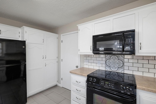 kitchen with black appliances, a textured ceiling, backsplash, white cabinets, and light countertops