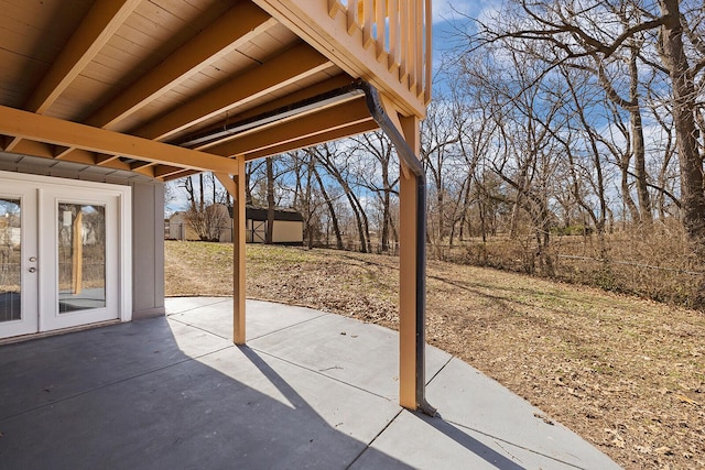 view of patio / terrace with french doors and fence