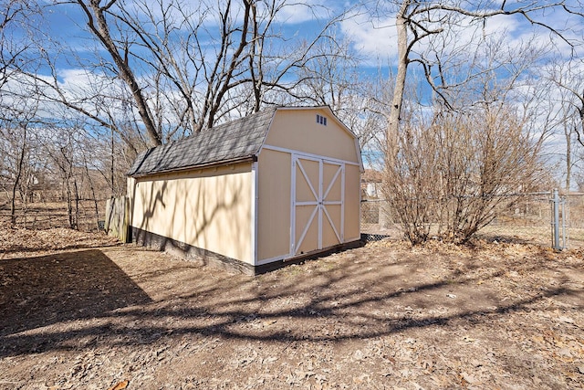 view of shed with fence