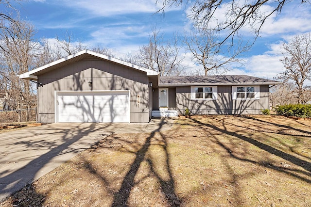 view of front facade featuring driveway and an attached garage