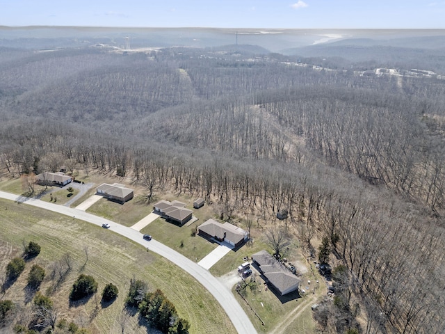 drone / aerial view with a rural view and a wooded view