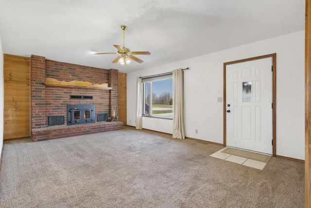 unfurnished living room featuring baseboards, carpet, and a ceiling fan