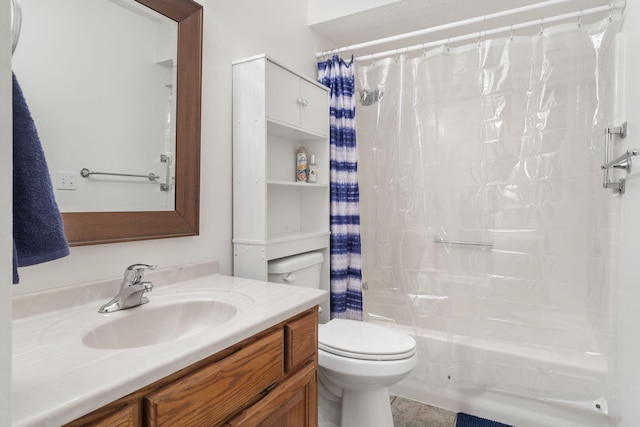 full bathroom with toilet and vanity