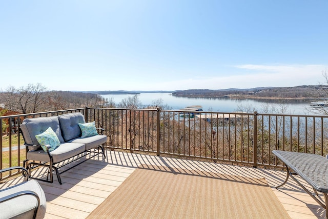 wooden deck featuring a water view