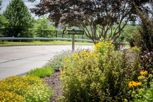 surrounding community featuring a water view