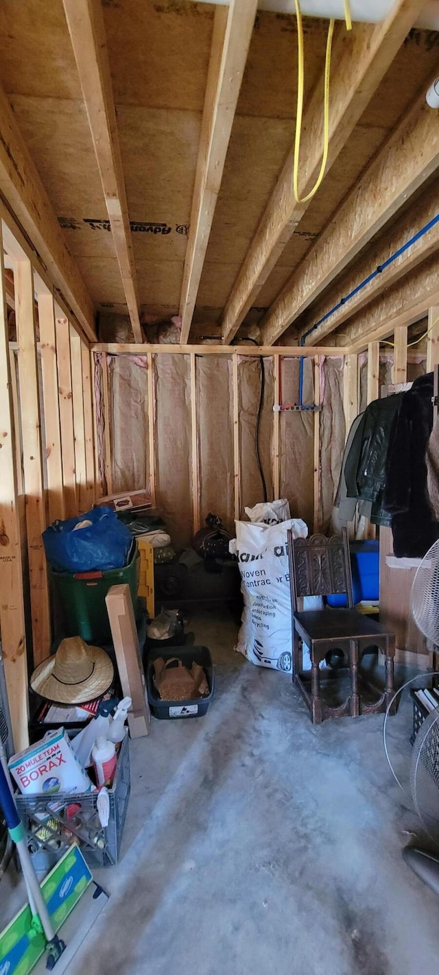 misc room featuring unfinished concrete flooring