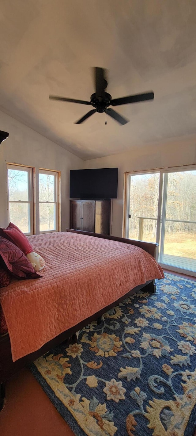 bedroom with access to exterior, a ceiling fan, and lofted ceiling