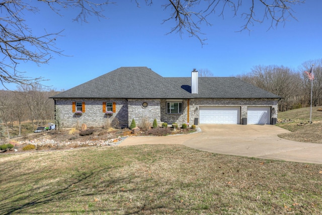 view of front of property with a garage, a front lawn, roof with shingles, and driveway