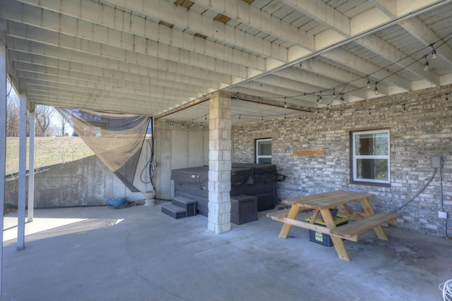 view of patio with a hot tub