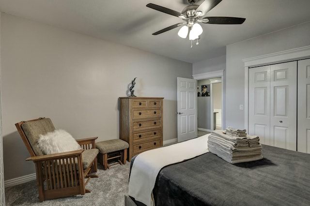 carpeted bedroom featuring a closet, baseboards, and ceiling fan