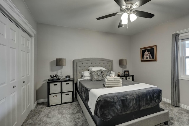 bedroom featuring a closet, ceiling fan, baseboards, and carpet floors