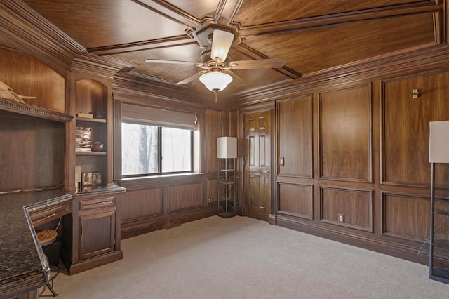 interior space featuring ceiling fan, wooden ceiling, wood walls, and carpet floors