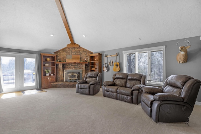 living area featuring vaulted ceiling with beams, carpet, and a textured ceiling