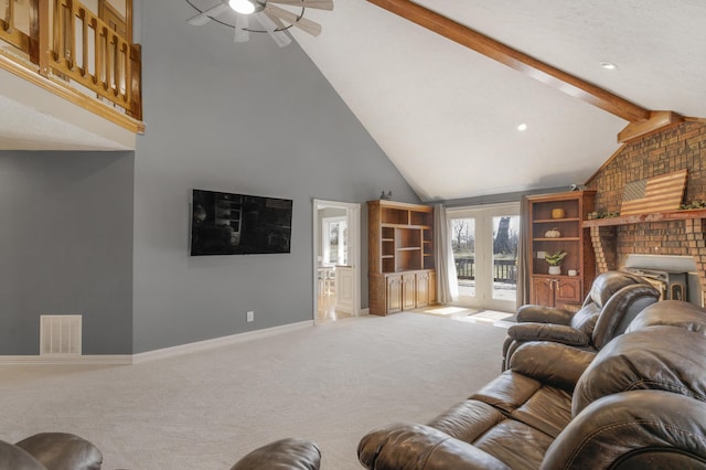 carpeted living area with baseboards, visible vents, high vaulted ceiling, beam ceiling, and ceiling fan