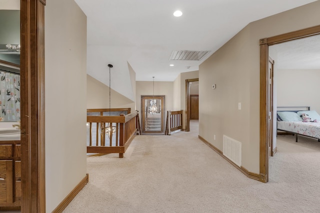 corridor with recessed lighting, visible vents, baseboards, and carpet