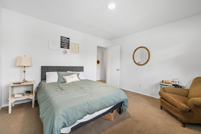 carpeted bedroom with baseboards