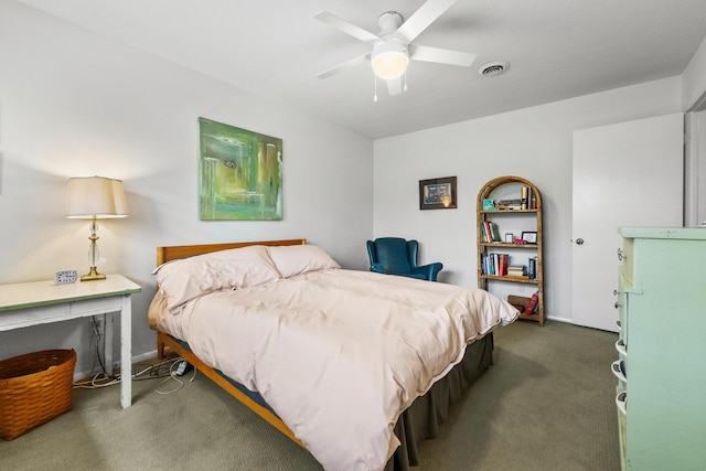 carpeted bedroom with visible vents and a ceiling fan