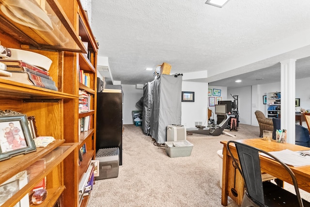 office space featuring carpet and a textured ceiling